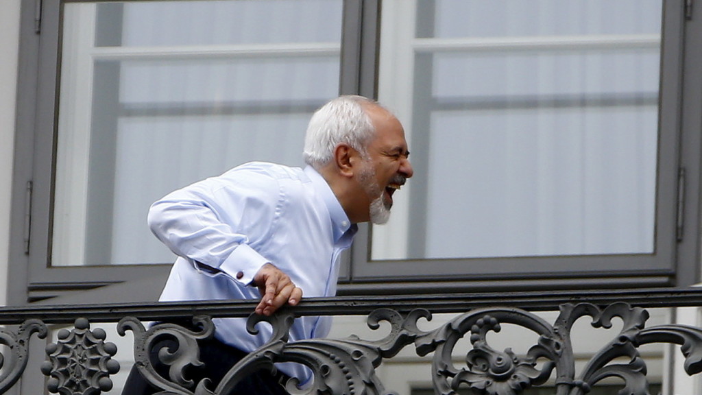 Iranian Foreign Minister Zarif stands on the balcony of Palais Coburg, the venue for nuclear talks, in Vienna
